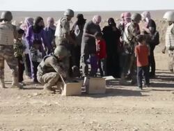 Jordanian Soldiers hand out supplies to refugees Stock Footage