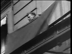 B/W 1927 low angle Charles Lindbergh holding French flag after historic trans-Atlantic flight / Paris Stock Footage