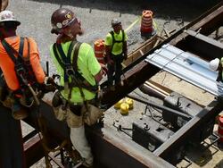 Steelworkers construct a 12-story commercial building Stock Footage