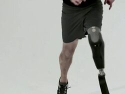Athlete running with prosthetic leg Stock Footage