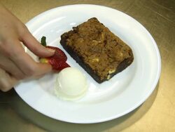 Making a dessert of Icecream, strawberry and cake - HD Stock Footage