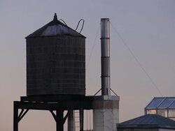 Water towers hold a water supply for a New York City neighborhood. Stock Footage
