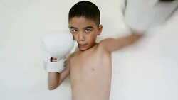 Little boy training boxing Stock Footage