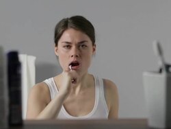 CU, Lockdown, Young woman brushing her teeth Stock Footage