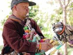Hmong man playing the saxophone invented by himself. Stock Footage