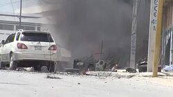 CLEAN : Twin blasts kill five in attack on Somalia's security ministry News Clip