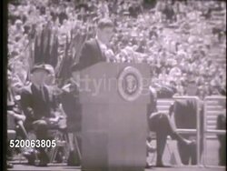 1963: UNITED STATES AIR FORCE ACADEMY: ** VS US President John F. Kennedy (JFK) standing at podium in Falcon Stadium during graduation ceremony, delivering speech (SOT) about graduates, Air Force, freedom, service of country. Instructional Video