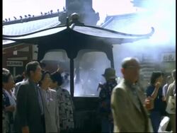 MS Worshippers at giant incense burner, Sensoji temple, Asakusa, Tokyo, Japan, Stock Footage
