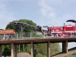 MS View of machines working over bridge construction site, preparing demolition of old bridge at Saar river / Wiltingen, Rhineland Palatinate, Germany Stock Footage