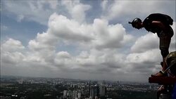 CLEAN : Basejumpers leap off KL Tower in Malaysia News Clip