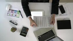 Business person analyse financial data in overhead angle Stock Footage