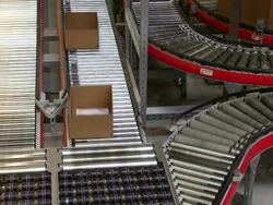 MS Parcels moving on conveyor belts at warehouse of catalog company / Grossostheim, Bavaria, Germany Stock Footage