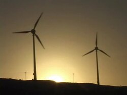 MS, LA, Brazil, Ceara, Fortaleza, Silhouettes of wind turbines against sky at sunset Stock Footage