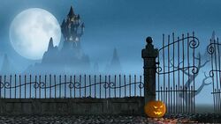Halloween pumpkins next to a gate of a spooky castle Stock Footage