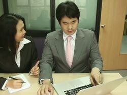 Dolly: Businesswoman Working laptop with manager coaching Stock Footage