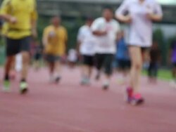 Group of people jogging on the running track Stock Footage