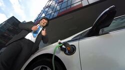 HD: Showing Thumbs Up While Charging Car Stock Footage