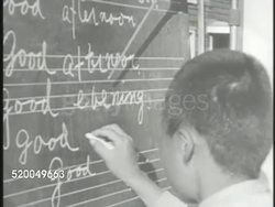 1945: SOUTH KOREA: EDUCATION: VS South Korean students, young teenage males, learning English in outdoor class, boy writing words on chalkboard, students reciting (no SOT), student bowing to instructor, teacher. Foreign language Instructional Video