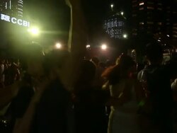 people celebrating on street in circle and waving hands in hong kong, real time. Stock Footage