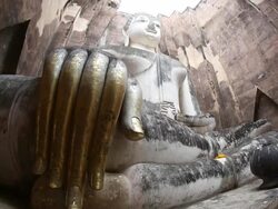 Tilt-up shot: Big buddha in Sukhothai historical park Thailand Stock Footage