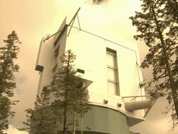 Low Angle static - A large, rotating structure houses a modern telescope / Large Binocular Telescope, Mount Graham, Arizona Stock Footage