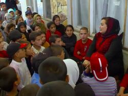 MS Shukria talking to students at daycare center / Kabul, Kabul Province, Afghanistan Stock Footage