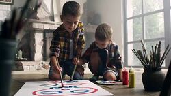 Little boys painting at the artist's studio Stock Footage