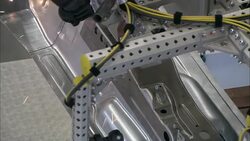 Robots weld parts in an automotive factory. Stock Footage