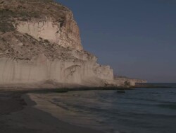 MS View of Cala de Enmedio Beach and Volcanic Cliffs at Cabo de Gata Natural Park / Agua Amarga, Andalusia, Spain Stock Footage