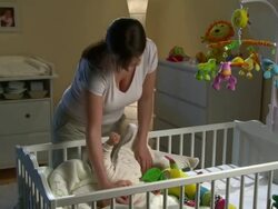 HD DOLLY: Mother Taking Care Of Sleepless Baby Stock Footage