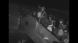 Australian troops getting on airplane in Australia to depart for Korean War News Clip