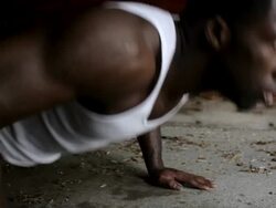 CU Young man doing push-ups inside  garage while working out / Minneapolis, Minnesota, United States Stock Footage
