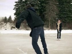 Young adult couple skating together in winter.. Stock Footage