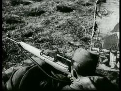 German soldiers are trained to become snipers. The soldiers practice at a shooting range and in the open field (where they shoot from camouglaged positions) Stock Footage