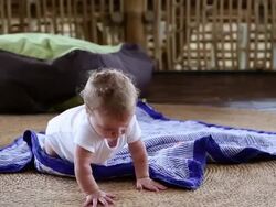 MS Shot of baby trying to crawl / Ubud, Bali, Indonesia Stock Footage