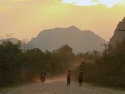 WS People walking on road at evening /  Vang Vieng, Vientiane, Laos Stock Footage