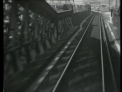 POV railway track and bridge, flanked by houses in Midlands or the North of England, United Kingdom, 1939 Stock Footage