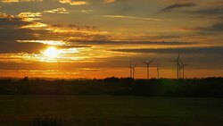 Video of windmills at the sunset in 4K Stock Footage