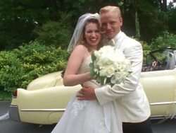 MS Newlywed bride and groom hugging near classic convertible, then bride tosses bouquet / Washington State, USA Stock Footage