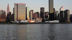 Golden-hour light reflects off skyscrapers in the Manhattan skyline. Stock Footage