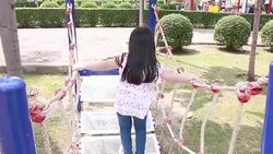 Pretty girl is playing and enjoy in amusement park Stock Footage