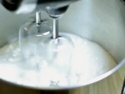 Mixing batter for onion rings Stock Footage