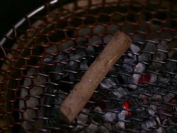 ECU PAN Wooden sticks on barbecue grill / Seoul, South Korea Stock Footage