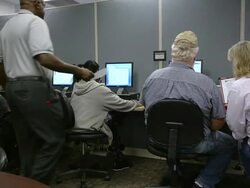 MS PAN Job seekers studing computer screens at state run job center / Jackson, Michigan, United States  Stock Footage