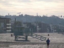 (HD1080i) Aircraft Lands behind Beach Runner Stock Footage