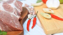 HD dolly:fresh pork chop on wood board with Condiment. Stock Footage