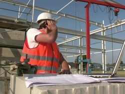 Building Contractor at construction site Stock Footage