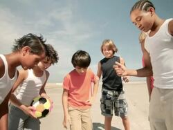 Boys tossing a coin before football game Stock Footage