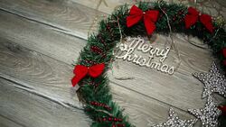 Christmas wreath with decorations on the shabby wooden background Stock Footage