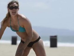 CU of a female beach volleyball player diving for the ball. Stock Footage